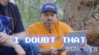 a man wearing a blue hat says " i doubt that " while using a tablet