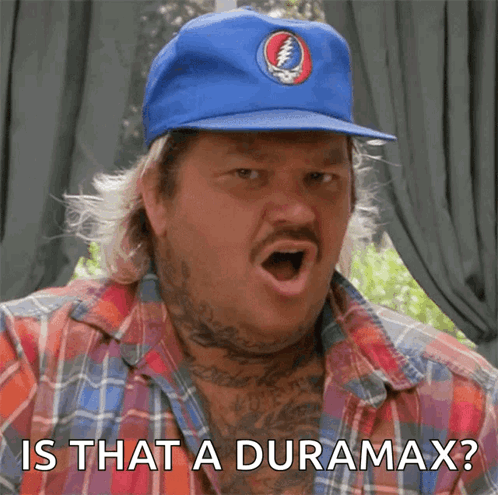 A Man Wearing A Blue Hat With A Grateful Dead Logo On It Says " Is That A Duramax " GIF