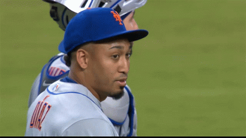 A Man Wearing A Blue Hat With The Letter N On It GIF