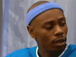 A Man Wearing A Blue Headband And A Blue Shirt Looks To The Side GIF