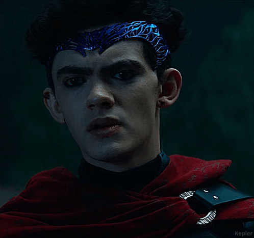 A Man Wearing A Blue Headband And A Red Cape With Kepler Written On The Bottom GIF