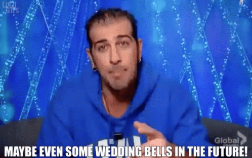A Man Wearing A Blue Hoodie Says " Maybe Even Some Wedding Bells In The Future " GIF
