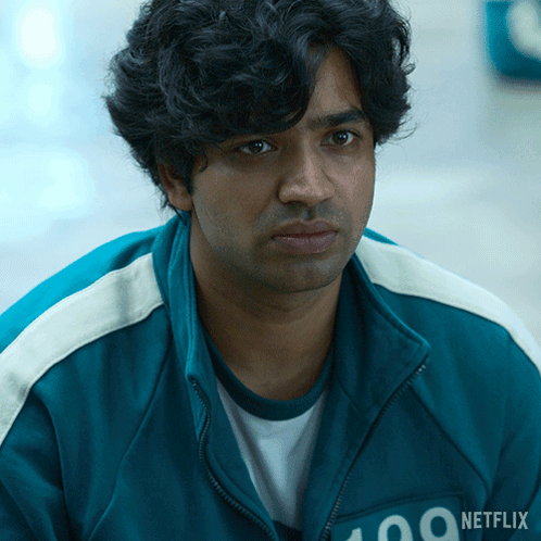 A Man Wearing A Blue Jacket That Says 100 On It GIF