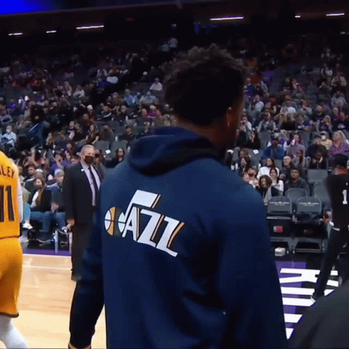 A Man Wearing A Blue Jacket That Says Jazz GIF