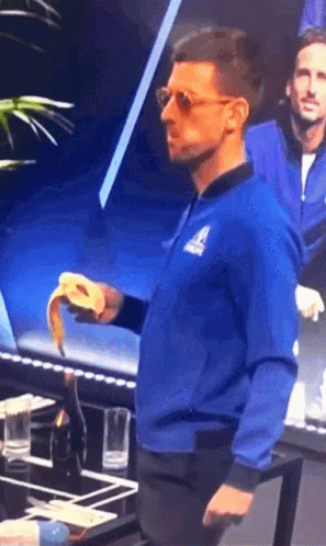 A Man Wearing A Blue Jacket With The Letter A On The Front GIF