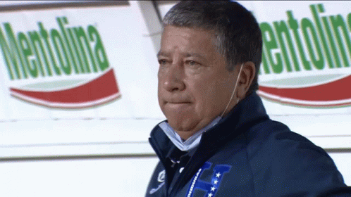 A Man Wearing A Blue Jacket With The Letter H On The Front GIF