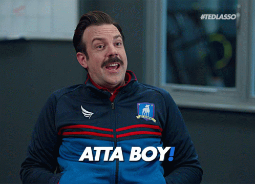 A Man Wearing A Blue Jacket With The Word Atta Boy On It GIF