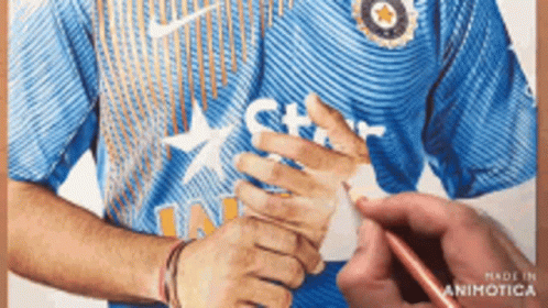 A Man Wearing A Blue Nike Shirt With A Star On The Front GIF
