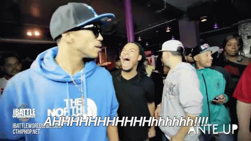A Man Wearing A Blue North Face Hoodie Screams In A Crowd GIF