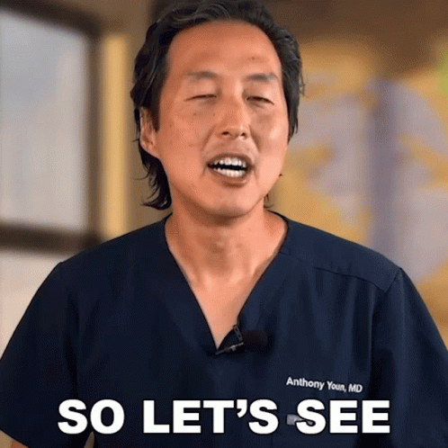 A Man Wearing A Blue Scrub Top Says So Let 'S See GIF