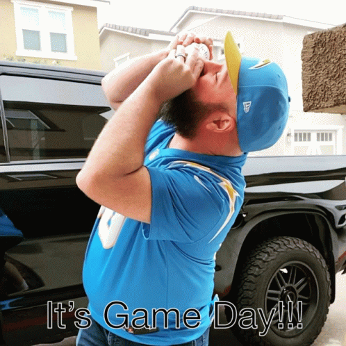 A Man Wearing A Blue Shirt And A Blue Hat With The Words " It 'S Game Day " On The Bottom GIF