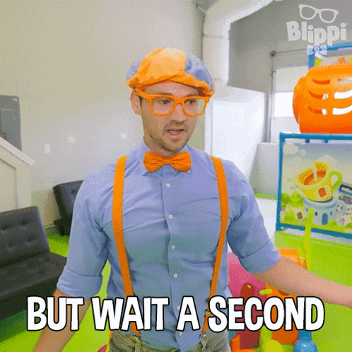 A Man Wearing A Blue Shirt And Orange Suspenders Says " But Wait A Second " GIF