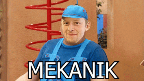 A Man Wearing A Blue Shirt And Overalls With The Word Mekanik On The Bottom GIF