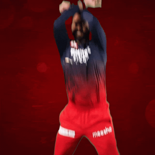 a man wearing a blue shirt and red pants with the word moesho on the side