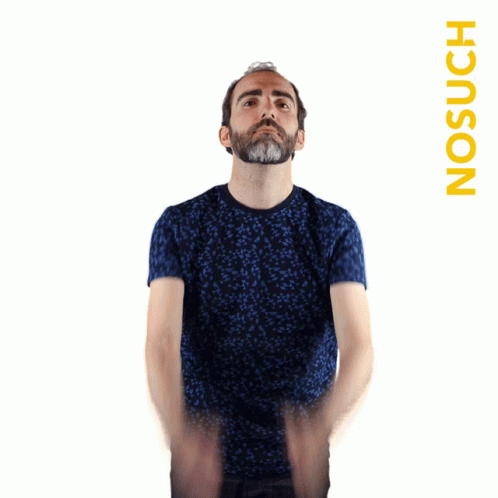 A Man Wearing A Blue Shirt Is Standing In Front Of A White Background With The Word No Such On It GIF