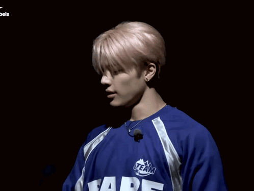A Man Wearing A Blue Shirt That Says " Bape " On It GIF