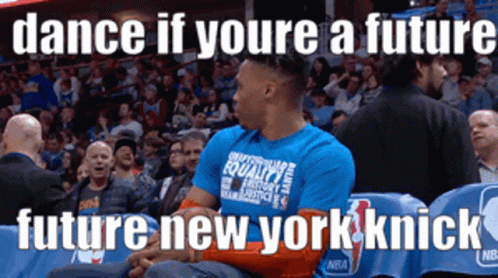 A Man Wearing A Blue Shirt That Says Dance If Youre A Future Future New York Knick Is Sitting In The Stands GIF