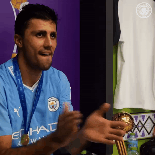 A Man Wearing A Blue Shirt That Says Etihad On It GIF