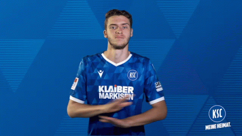 A Man Wearing A Blue Shirt That Says Klaber Markisen On It GIF
