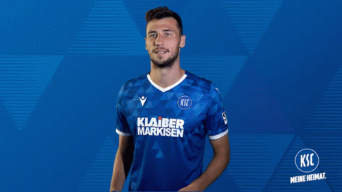 A Man Wearing A Blue Shirt That Says Klarer Markisen On It GIF