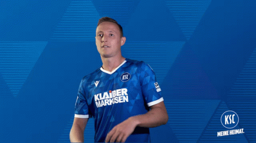 a man wearing a blue shirt that says ksc