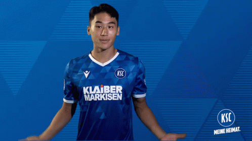 A Man Wearing A Blue Shirt That Says Ksic GIF