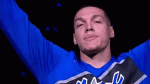 A Man Wearing A Blue Shirt That Says Magic Is Smiling GIF