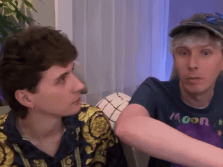 A Man Wearing A Blue Shirt That Says Moon On It GIF