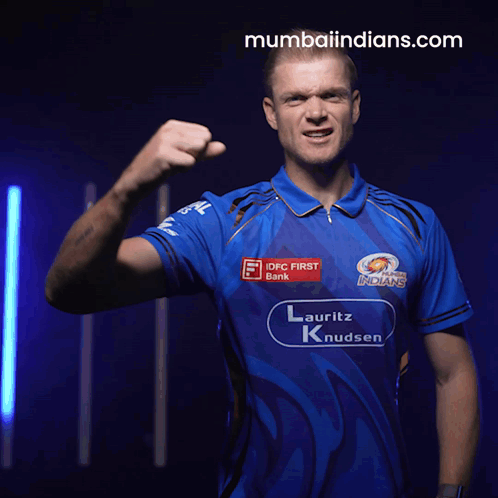 A Man Wearing A Blue Shirt That Says Mumbai Indians GIF