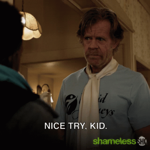 A Man Wearing A Blue Shirt That Says Nice Try Kid GIF