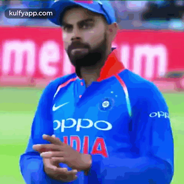 A Man Wearing A Blue Shirt That Says Oppo India On It GIF