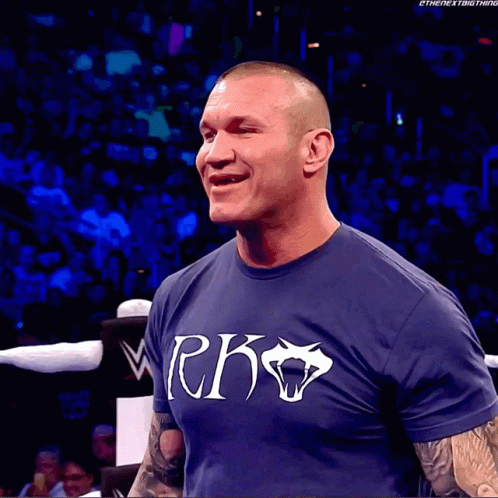A Man Wearing A Blue Shirt That Says Rko GIF
