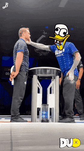 Man In Blue Slam Dunk Shirt Next To Another Man GIF