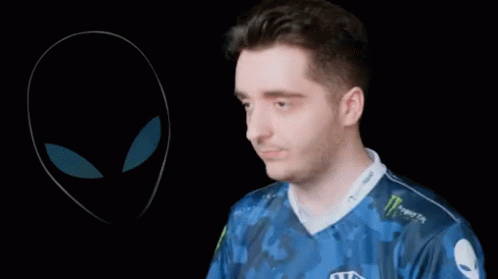 A Man Wearing A Blue Shirt That Says Team Liquid Adjusts His Headphones GIF
