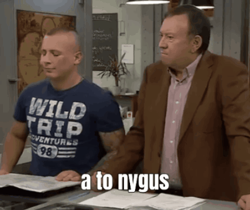 A Man Wearing A Blue Shirt That Says Wild Trip GIF