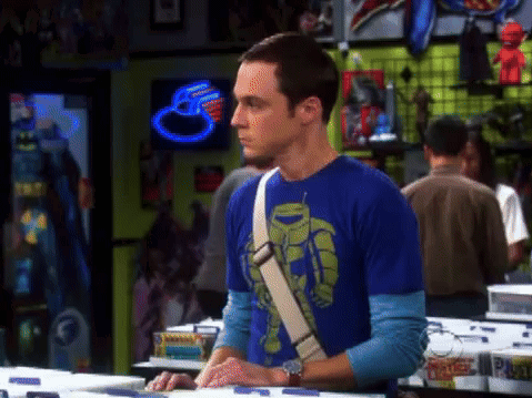 Man In Blue Shirt With Robot Stands In Store GIF