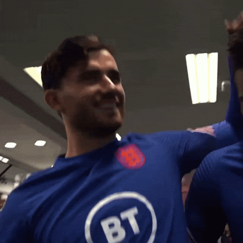 A Man Wearing A Blue Shirt With Bt Written On It GIF