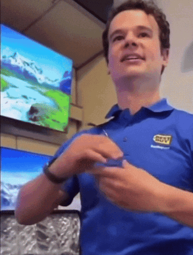 A Man Wearing A Blue Shirt With Gtv Written On It GIF