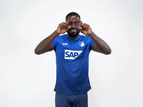 A Man Wearing A Blue Shirt With Sap On It GIF