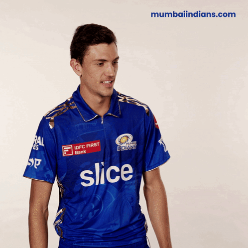 A Man Wearing A Blue Shirt With Slice On It GIF