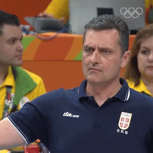 A Man Wearing A Blue Shirt With Srb On The Front GIF