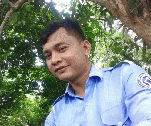 A Man Wearing A Blue Shirt With The Letter G On The Shoulder GIF