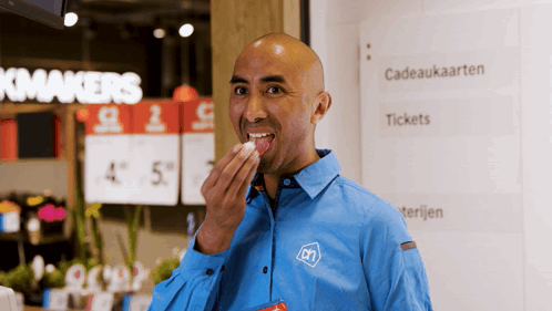 Man In Blue Shirt With CN Letters GIF