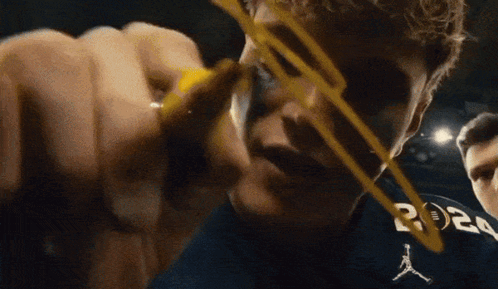 A Man Wearing A Blue Shirt With The Letters R On It GIF