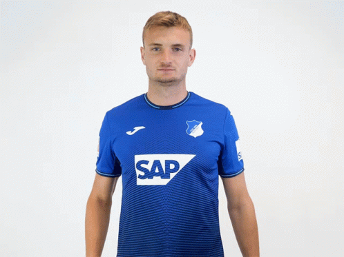 A Man Wearing A Blue Shirt With The Word Sap On The Front GIF