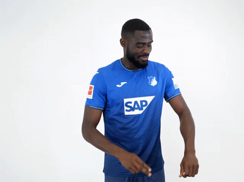 A Man Wearing A Blue Shirt With The Word Sap On The Front GIF