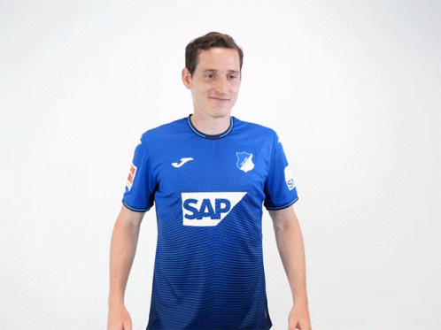 A Man Wearing A Blue Shirt With The Word Sap On The Front GIF