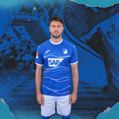 A Man Wearing A Blue Shirt With The Word Sap On The Front GIF