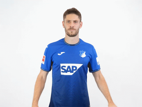 A Man Wearing A Blue Shirt With The Word Sap On The Front GIF