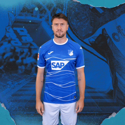 A Man Wearing A Blue Shirt With The Word Sap On The Front GIF
